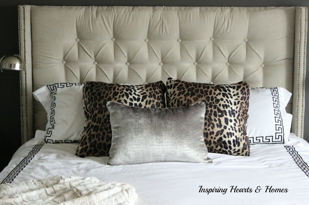 tufted headboard animal print pillows